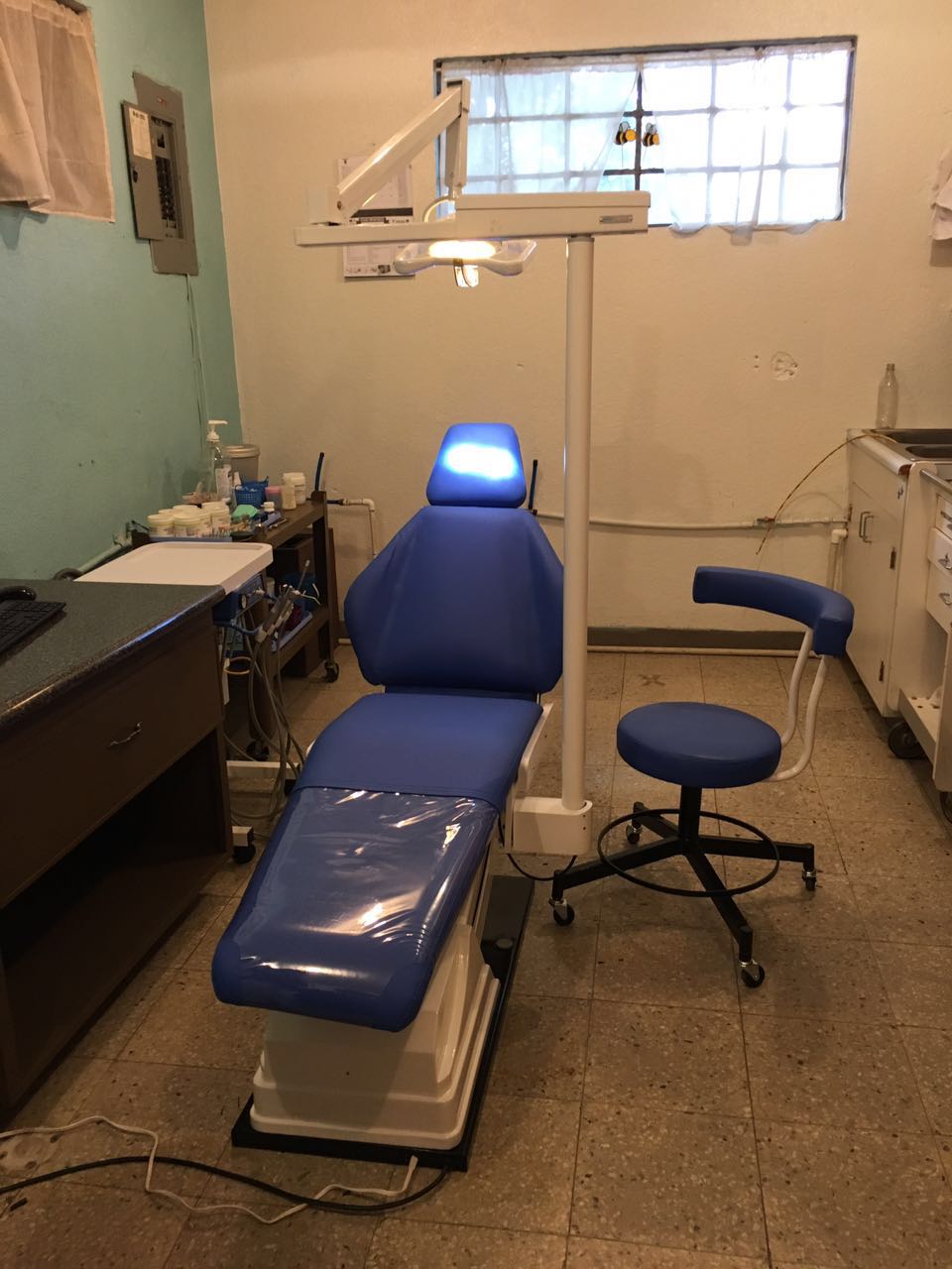 This is the dental chair, stool and light