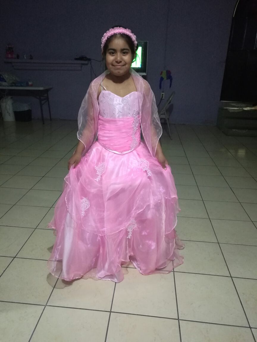 Cindy, dialysis, in her quinceanera's dress